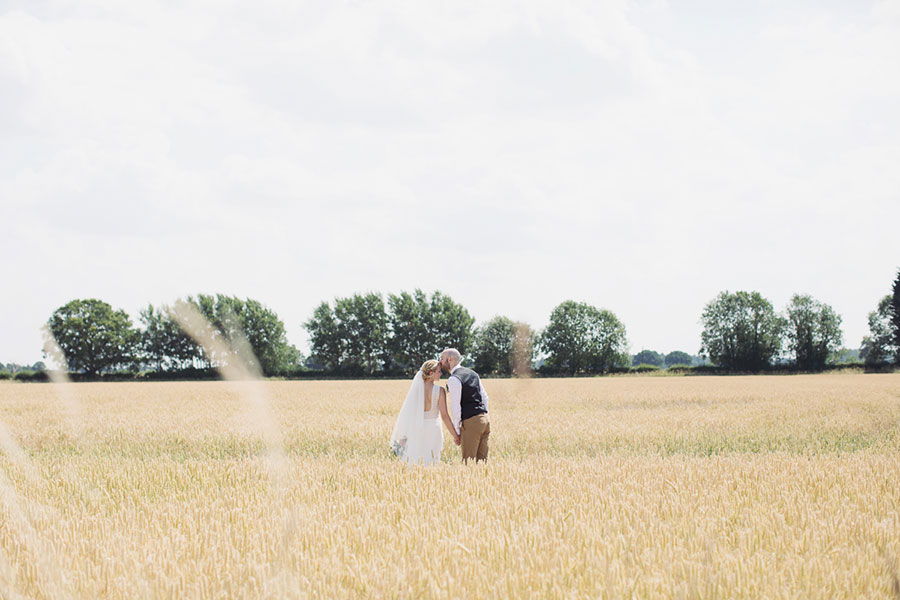 A beautiful English summer day York wedding at barn rustic venue Deighton Lodge with beautiful natural wedding photography of a cornfield pastel bride and groom shoot by Sasha Lee Photography